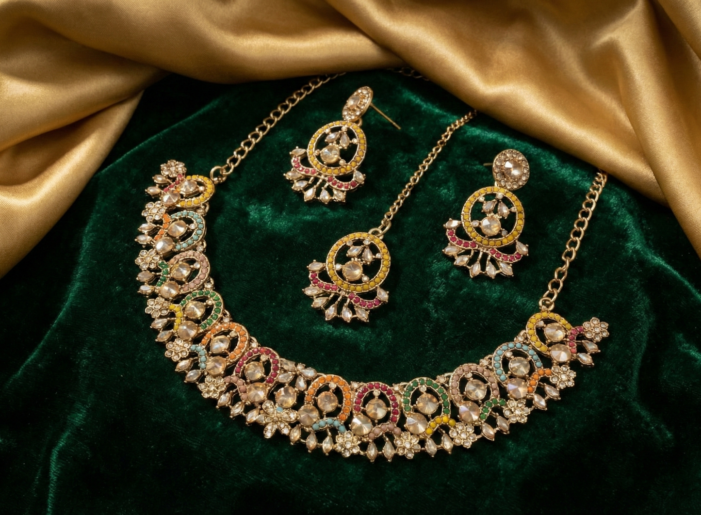 Close-up view of premium artificial Antique Gold Multi Color Stone Jewelry Set with Crescent Earrings & Maang Tikka by Innovate Art Impex.