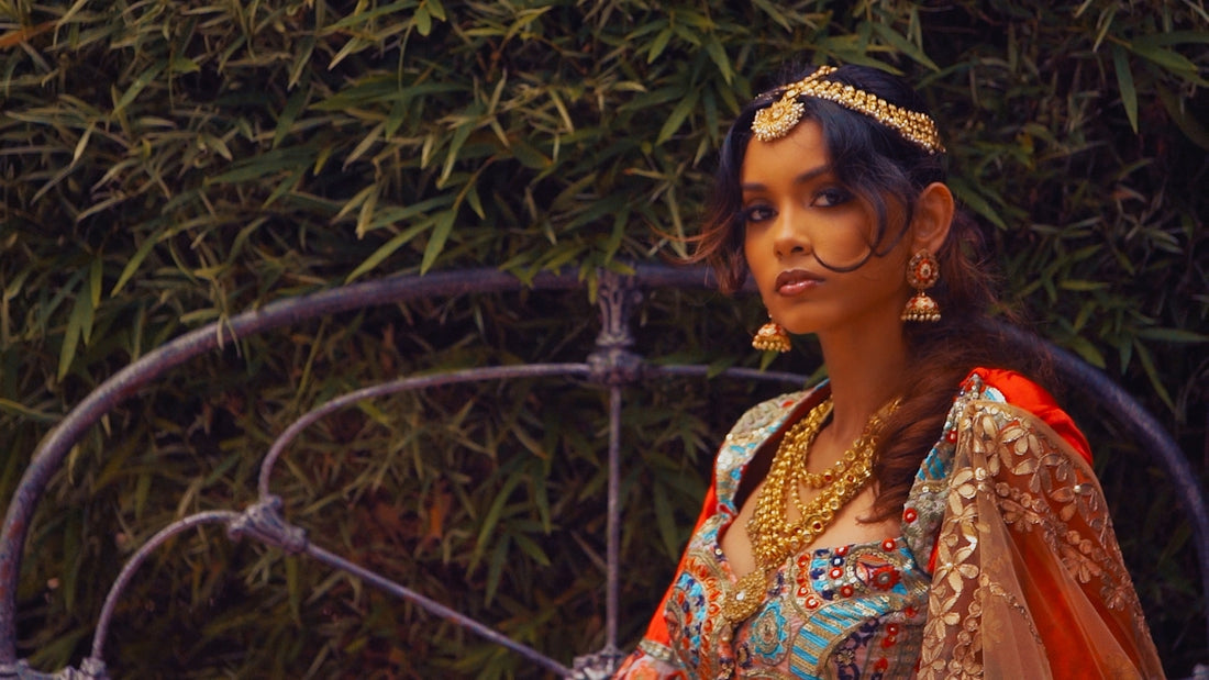 a woman wearing a head piece and jewelry