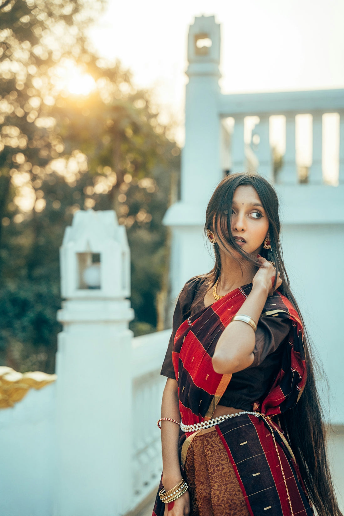 Woman in traditional indian attire on a balcony