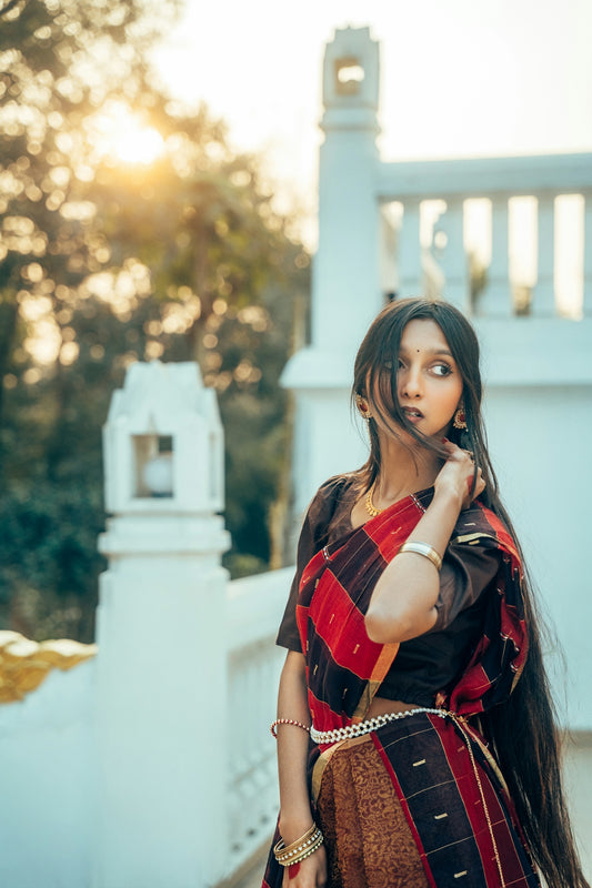 Woman in traditional indian attire on a balcony