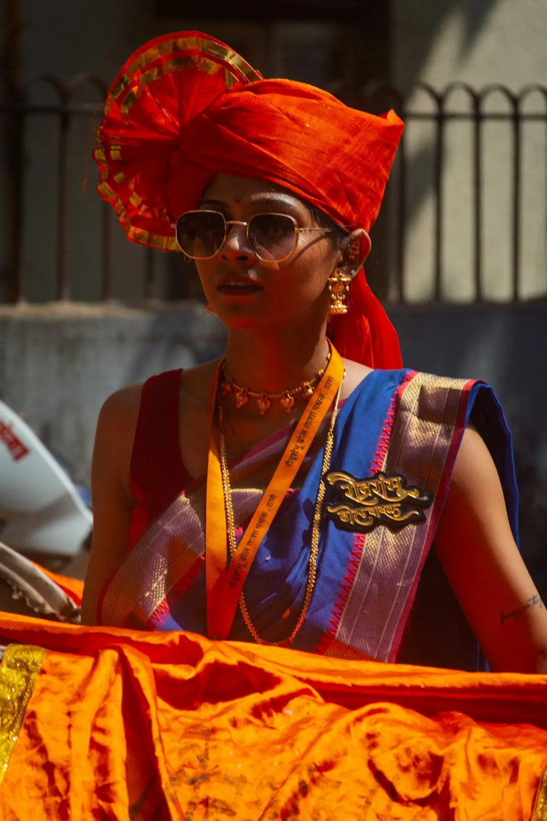 Woman in traditional attire and sunglasses