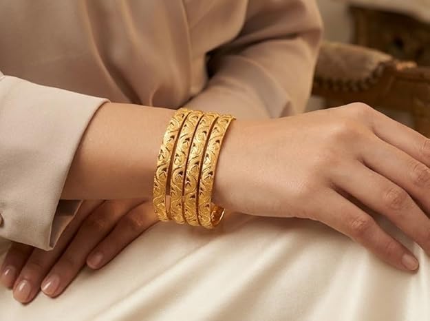 Close-up view of premium artificial Innovate Art Impex Traditional Bengali Gold Tone Alloy Bangle Set of 4 for Women | Intricate Cut-Out Leaf Pattern Ethnic Chudi Chura | Premium Anti-Tarnish Finish Shakha Pola Style Golden Bangles for Bridal Trousseau & Traditional Occasions by Innovate Art Impex.