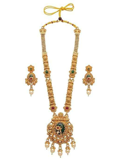 Close-up of INNOVATE ART IMPEX long temple haar necklace with matching stud earrings featuring green meenakari work, red stone accents, and pearl drops on a white background.