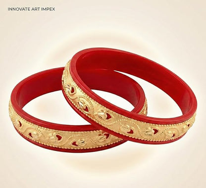Close-up view of premium artificial Innovate Art Impex Traditional Bengali Red Pala Bangles for Women - Set of 2 | Gold Plated Leaf Textured Brass Alloy Bangles | Ethnic Shakha Pola Style Jewelry for Weddings, Festivals & Daily Use by Innovate Art Impex.