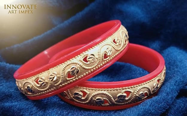 Close-up view of premium artificial Innovate Art Impex Traditional Bengali Red Pala Bangles for Women - Set of 2 | Gold Plated Leaf Textured Brass Alloy Bangles | Ethnic Shakha Pola Style Jewelry for Weddings, Festivals & Daily Use by Innovate Art Impex.