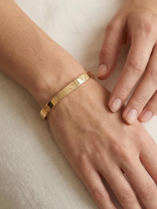 Close-up view of premium artificial Innovate Art Impex Women's Stylish Gold-Plated Screw Design Bracelet - Iconic Minimalist Bangle - High-Metal Imitation Jewellery - Free Size with Side Lock Closure by Innovate Art Impex.