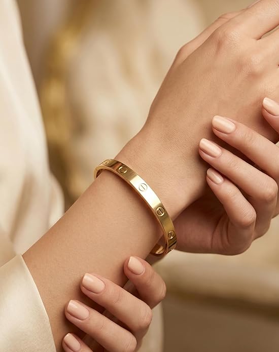 Close-up view of premium artificial Innovate Art Impex Women's Stylish Gold-Plated Screw Design Bracelet - Iconic Minimalist Bangle - High-Metal Imitation Jewellery - Free Size with Side Lock Closure by Innovate Art Impex.