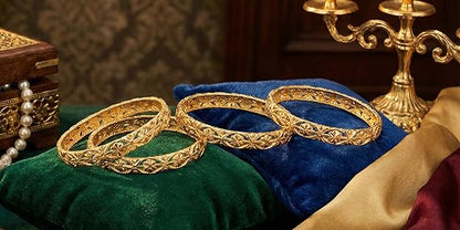 Close-up view of premium artificial Innovate Art Impex Traditional Bengali Golden Alloy Bangles Set of 4 for Women | Intricate Floral Filigree Cut-Out Ethnic Churi | Premium Artificial Gold Plated Bridal Wedding Jewelry | Festive Chudiya Pack for Girls by Innovate Art Impex.