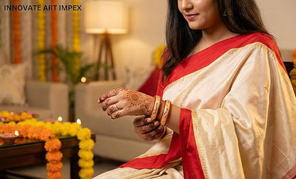 Close-up view of premium artificial Innovate Art Impex Traditional Bengali Red Pala Bangles for Women - Set of 2 | Gold Plated Leaf Textured Brass Alloy Bangles | Ethnic Shakha Pola Style Jewelry for Weddings, Festivals & Daily Use by Innovate Art Impex.