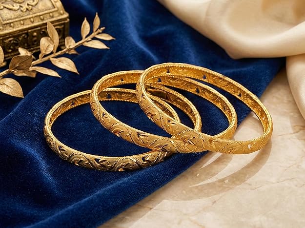 Close-up view of premium artificial Innovate Art Impex Traditional Bengali Gold Tone Alloy Bangle Set of 4 for Women | Intricate Cut-Out Leaf Pattern Ethnic Chudi Chura | Premium Anti-Tarnish Finish Shakha Pola Style Golden Bangles for Bridal Trousseau & Traditional Occasions by Innovate Art Impex.