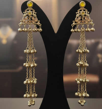 Close-up view of premium artificial Gold Plated Traditional Jhumka Drop Earrings with Yellow Stone & Long Chain Tassels by Innovate Art Impex.