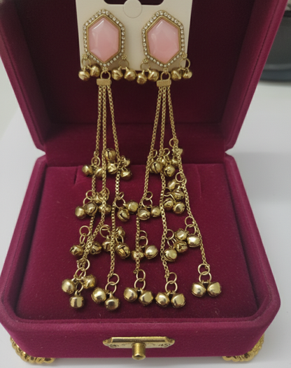 Close-up view of premium artificial Pink Hexagonal Stone Gold Tassel Drop Earrings   Elegant Statement Jewelry by Innovate Art Impex.