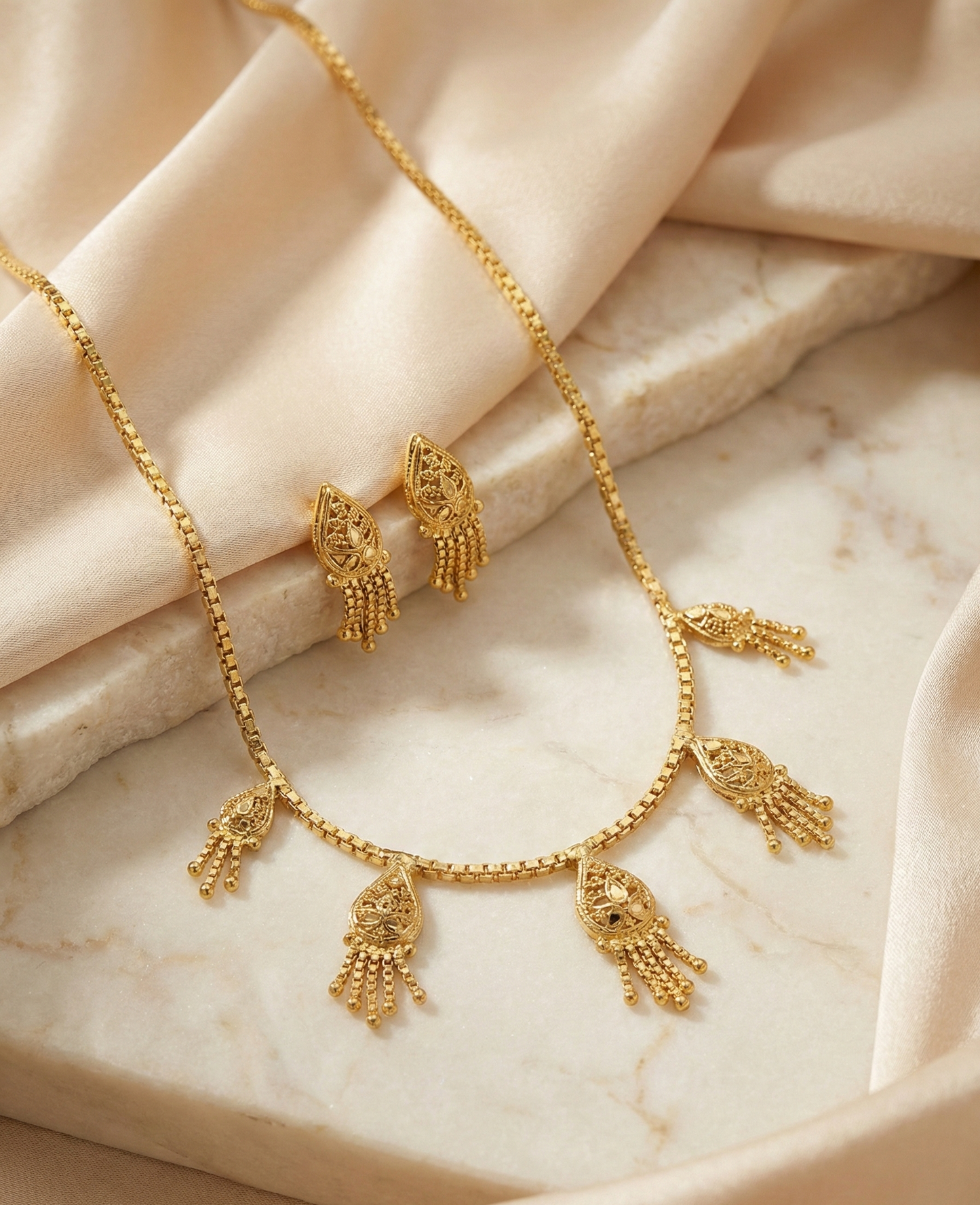 Close-up view of premium artificial Innovate AI Indian Antique Golden Colour Bridal Necklace Set for Women   Traditional Temple Jewellery with Drop Earrings   Ethnic Wedding Party Jwellery for Saree, Lehenga & Girls Dresses by Innovate Art Impex.