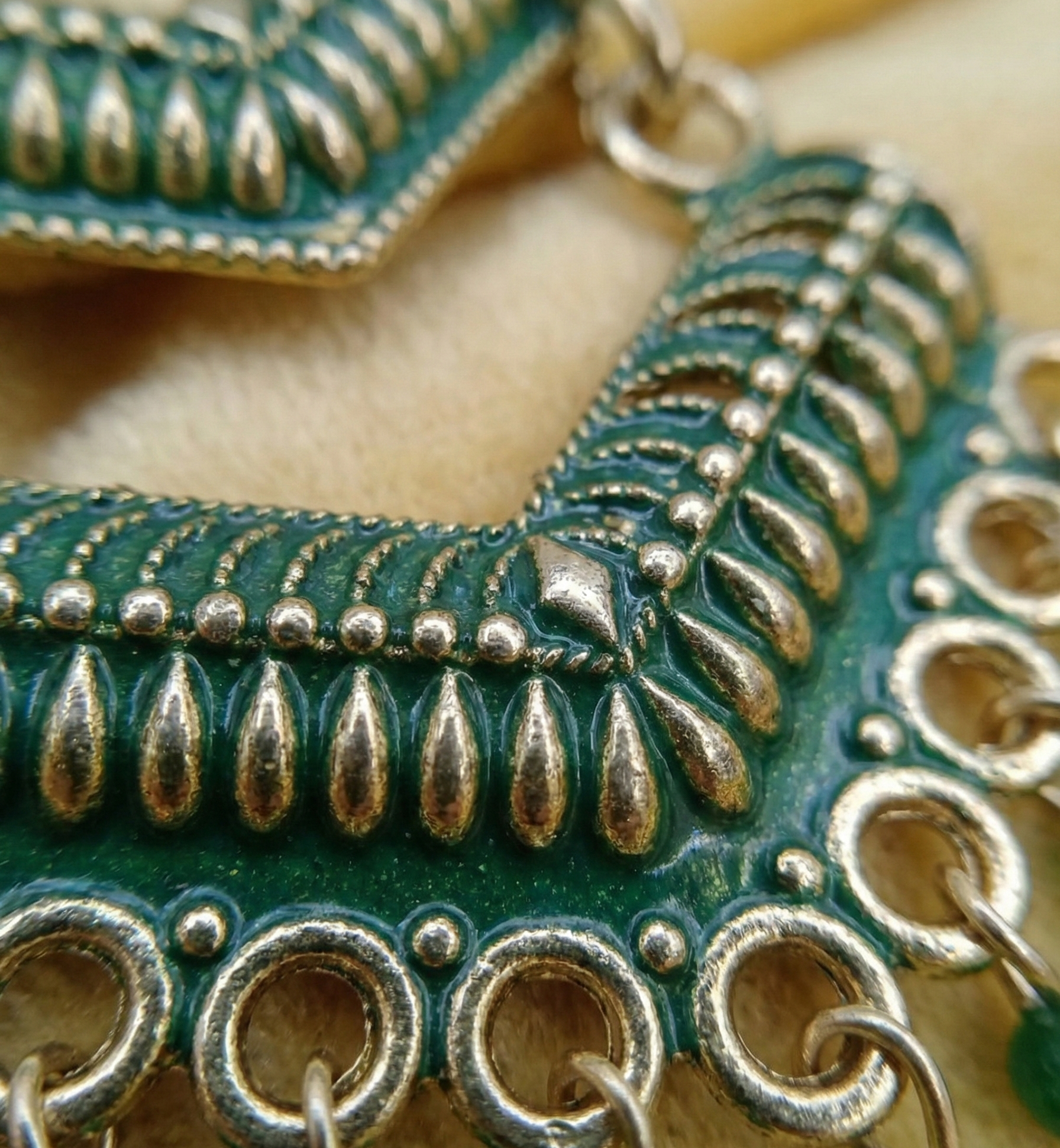 Close-up view of premium artificial Green Meenakari Gold Plated Layered Drop Earrings with Pearl Hanging by Innovate Art Impex.