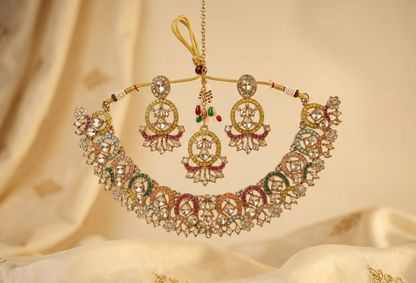 Close-up view of premium artificial Antique Gold Multi Color Stone Jewelry Set with Crescent Earrings & Maang Tikka by Innovate Art Impex.