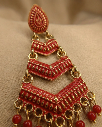 Close-up view of premium artificial Red Meenakari Gold Plated Layered Drop Earrings with Pearl Hanging by Innovate Art Impex.