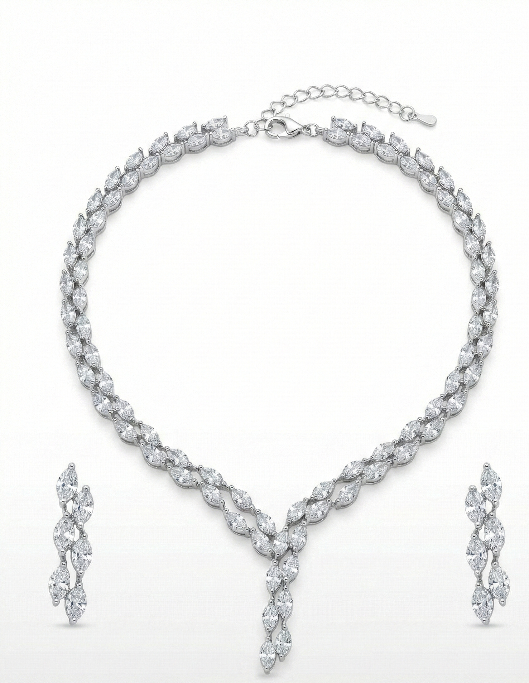 Close-up view of premium artificial Silver plated American Diamond marquise necklace and earring set on white by Innovate Art Impex.
