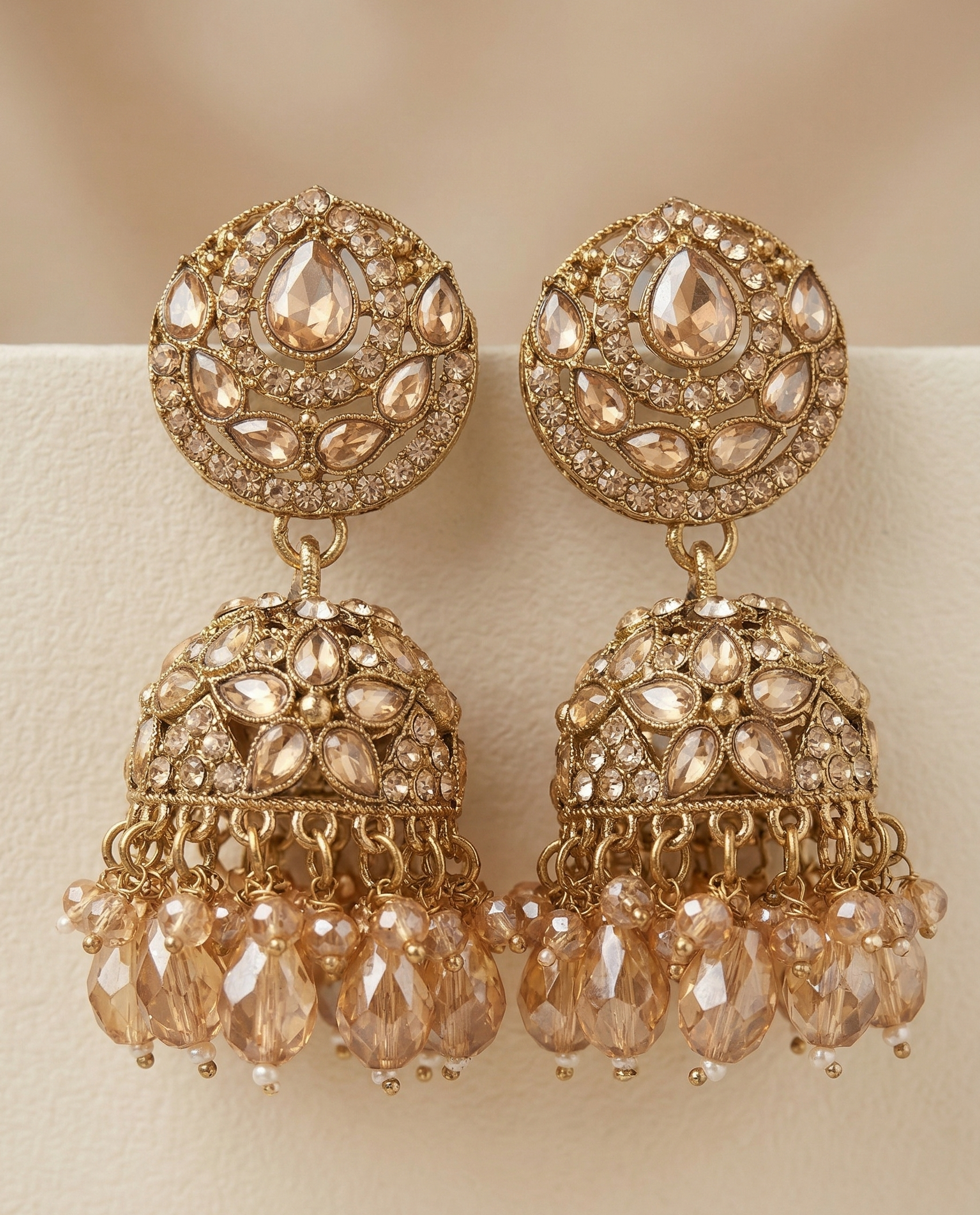 Close-up view of premium artificial Antique Gold Floral Leaf Design Jhumki Earrings with Handcrafted Bead Drops. by Innovate Art Impex.