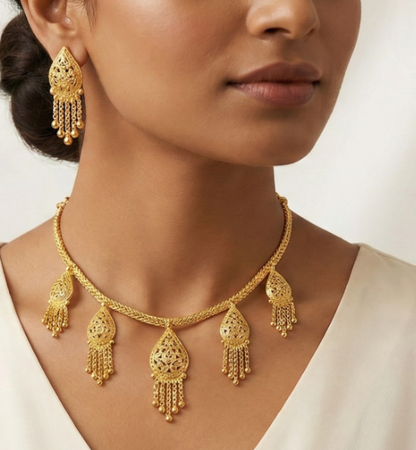 Close-up view of premium artificial Innovate Art Impex Gold Finished Filigree Teardrop Necklace with Jhumka Style Dangle Earrings   Ethnic Wedding Party Jwellery for Saree, Lehenga & Girls Dresses by Innovate Art Impex.