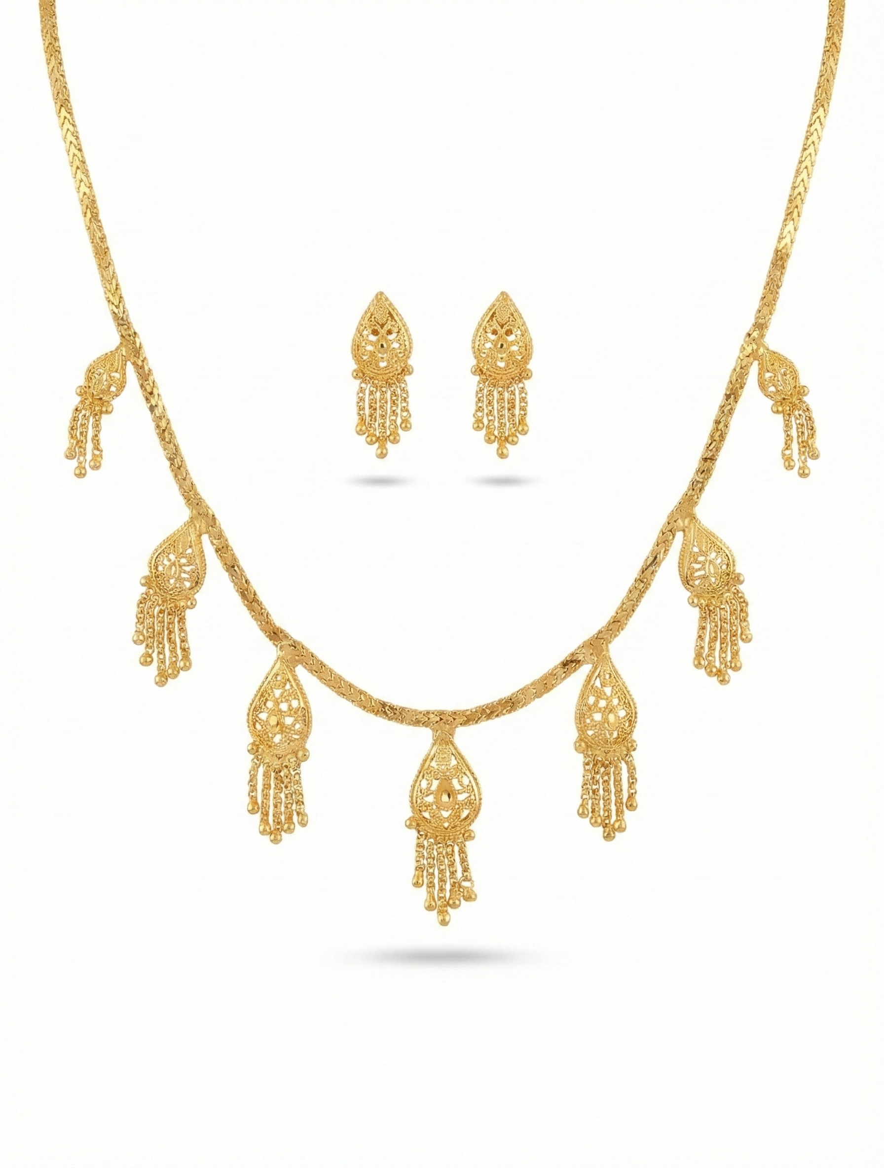 Close-up view of premium artificial Innovate Art Impex Gold Finished Filigree Teardrop Necklace with Jhumka Style Dangle Earrings   Ethnic Wedding Party Jwellery for Saree, Lehenga & Girls Dresses by Innovate Art Impex.