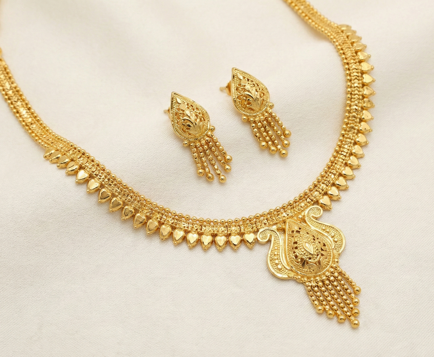 Close-up view of premium artificial Traditional Gold Toned Meenakari Inspired Temple Jewelry Set with Floral Filigree by Innovate Art Impex.