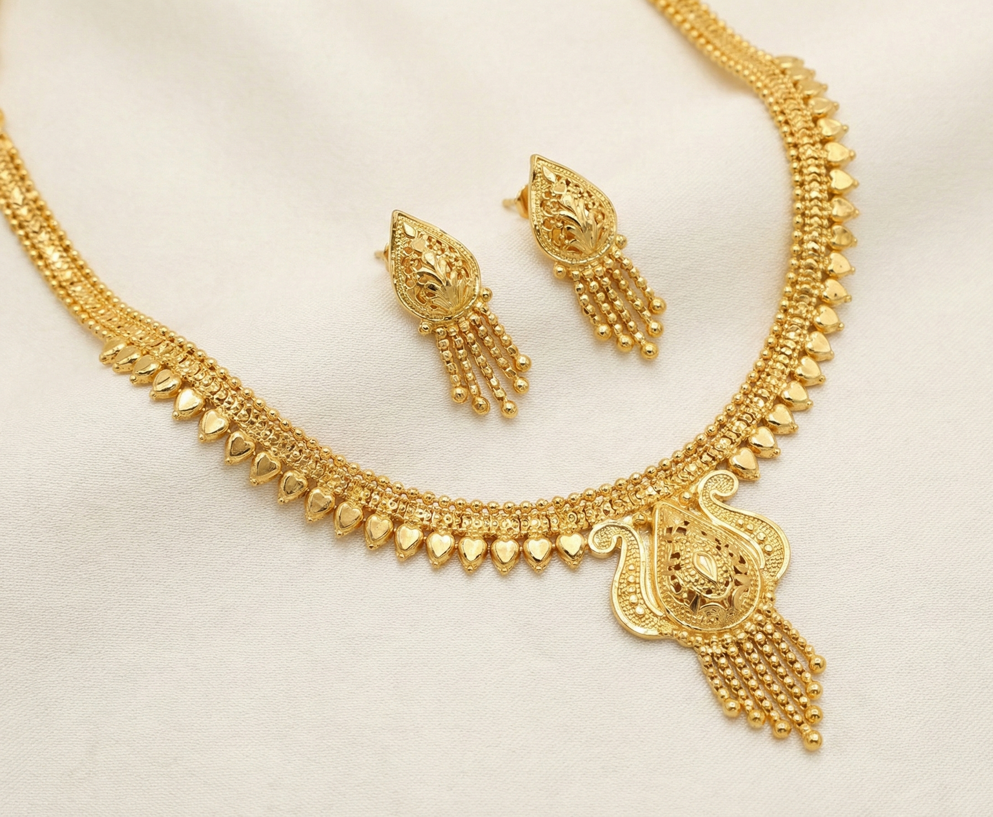 Close-up view of premium artificial Traditional Gold Toned Meenakari Inspired Temple Jewelry Set with Floral Filigree by Innovate Art Impex.