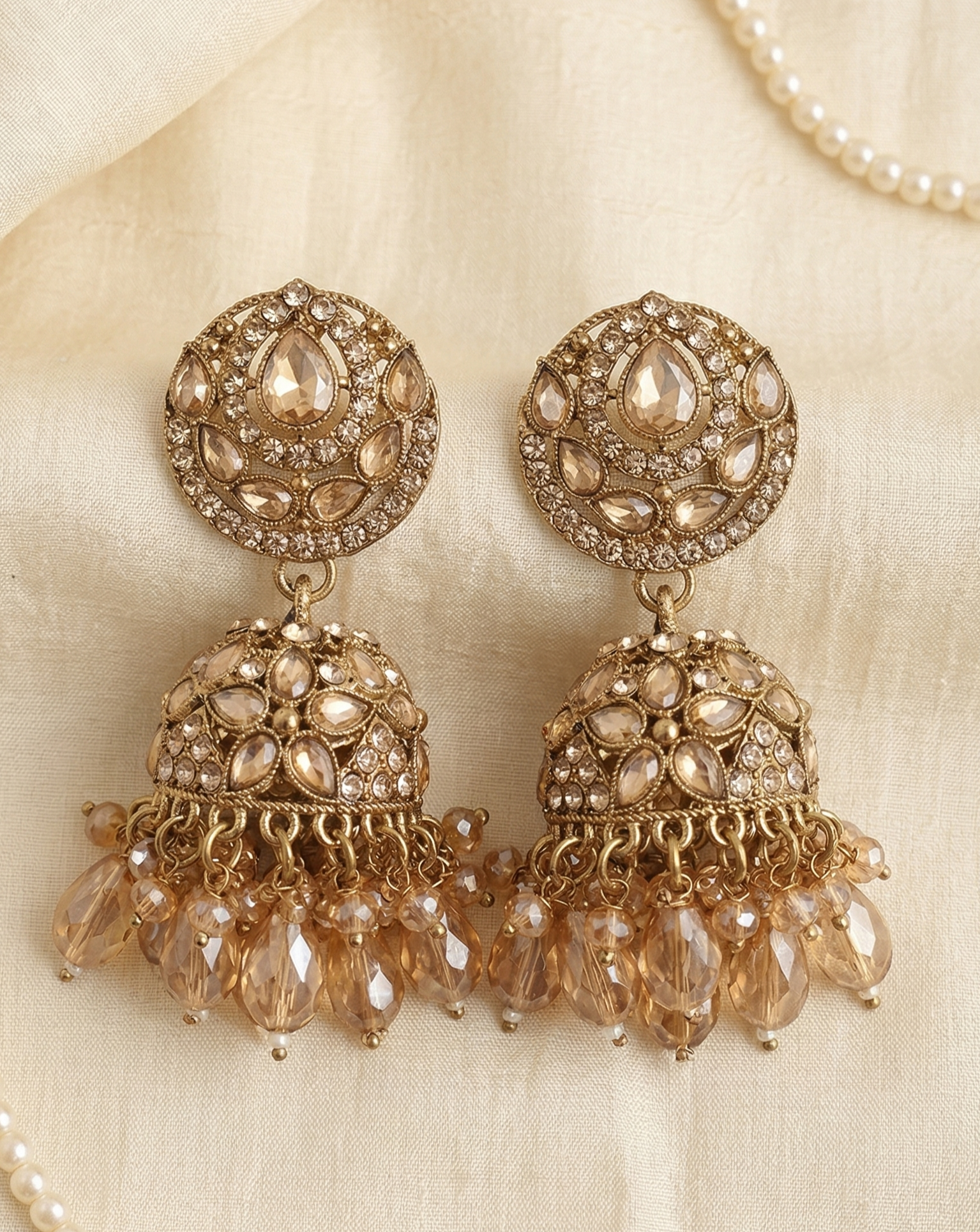 Close-up view of premium artificial Antique Gold Floral Leaf Design Jhumki Earrings with Handcrafted Bead Drops. by Innovate Art Impex.