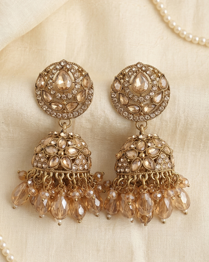 Close-up view of premium artificial Antique Gold Floral Leaf Design Jhumki Earrings with Handcrafted Bead Drops. by Innovate Art Impex.