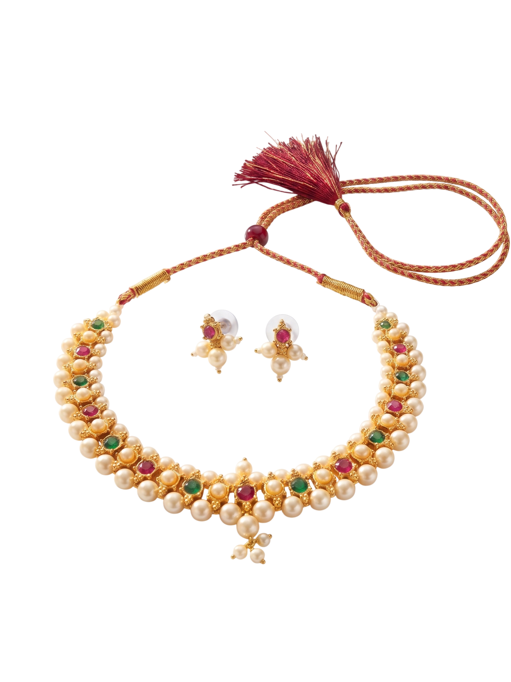 Flat lay of a gold-plated pearl choker necklace and matching stud earrings featuring ruby and emerald stones on a pure white background.