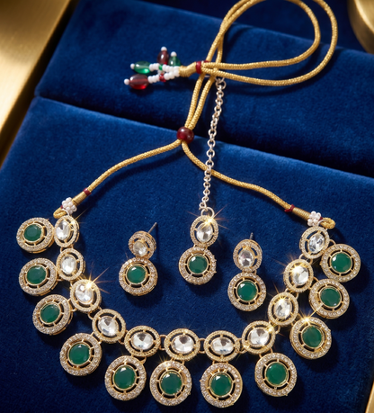 Jewelry set with necklace and earrings on a blue velvet background
