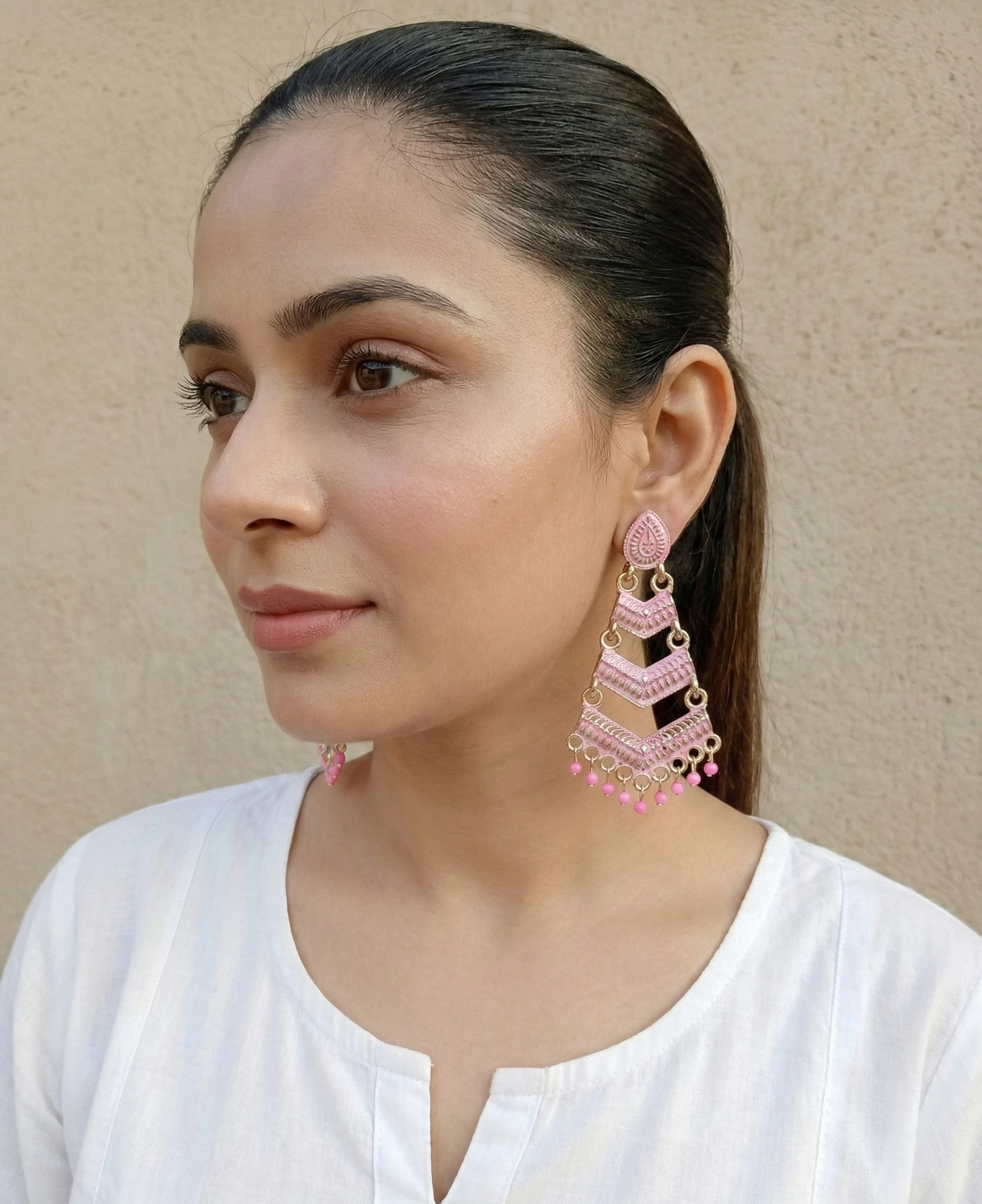 Close-up view of premium artificial Pink Meenakari Gold Plated Layered Drop Earrings with Pearl Hanging by Innovate Art Impex.