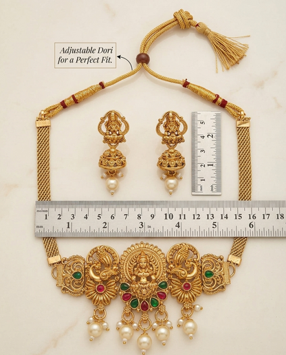 Gold necklace and earrings set with adjustable dori and ruler for size reference on a light background