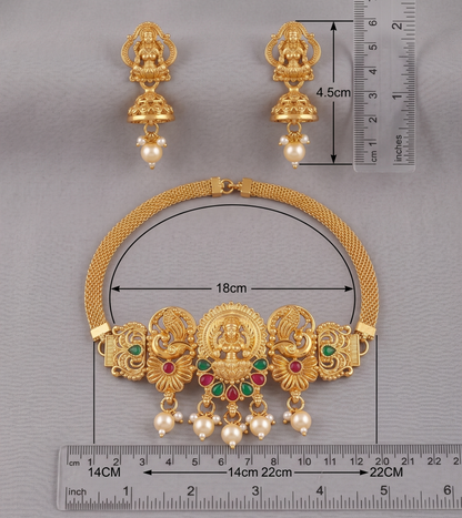 Gold necklace and earrings with measurements on a gray background