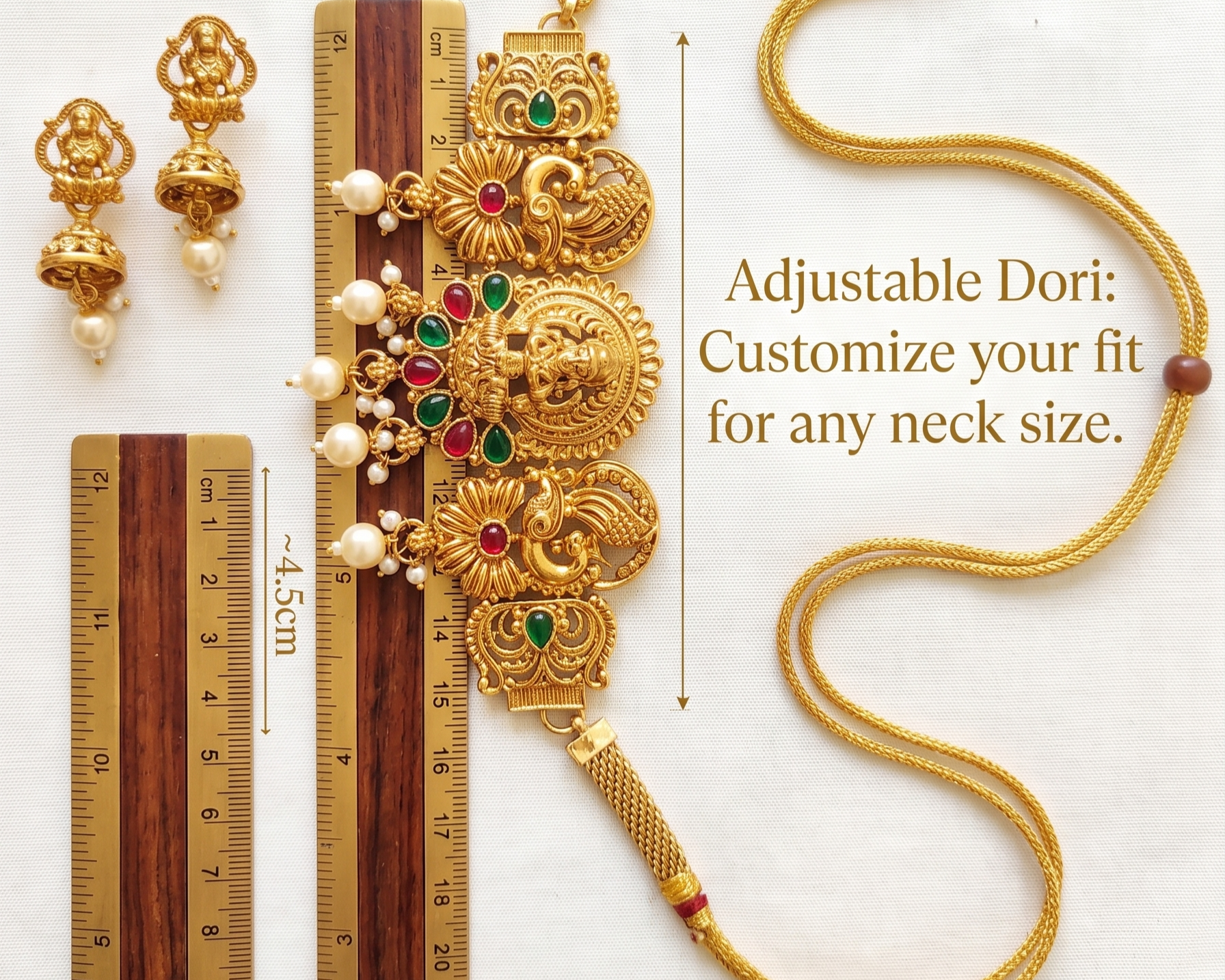 Gold necklace with adjustable dori, earrings, and measurement rulers on a white background.