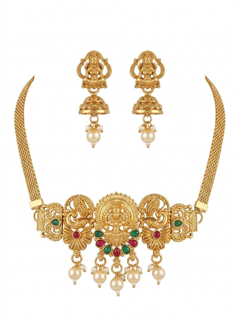 Gold necklace with matching earrings on a white background