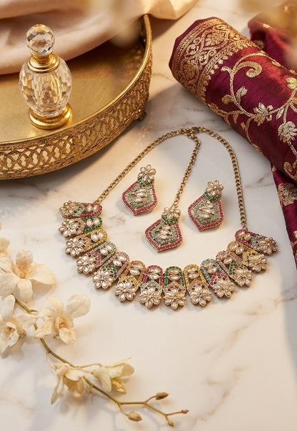 Close-up view of premium artificial Gold Toned Multi Color Geometric Mosaic Kundan Necklace Set Gold Plated Multi Color Floral Halo Necklace Set with Maang Tikka by Innovate Art Impex.