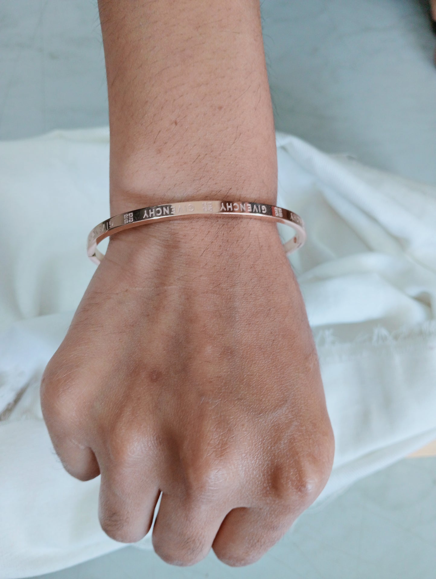 Close-up view of premium artificial INNOVATE ART IMPEX Premium Rose Gold Engraved Hinged Bangle Bracelet for Women by Innovate Art Impex.