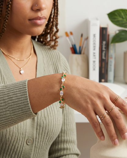 Gold-Toned Botanical Vine Link Bracelet with Clear Oval & Green Marquise American Diamonds