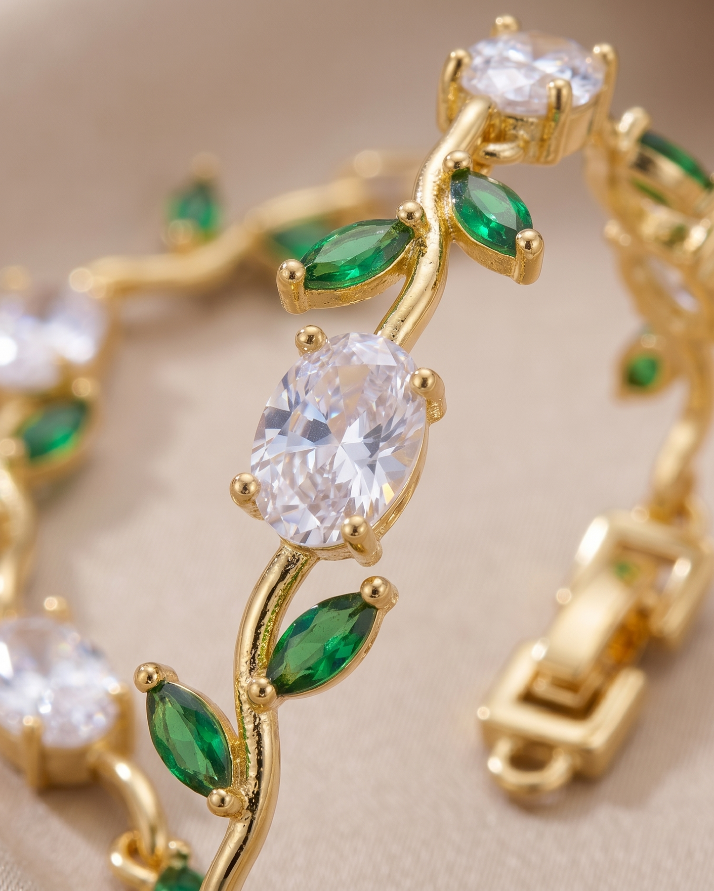 Gold-Toned Botanical Vine Link Bracelet with Clear Oval & Green Marquise American Diamonds