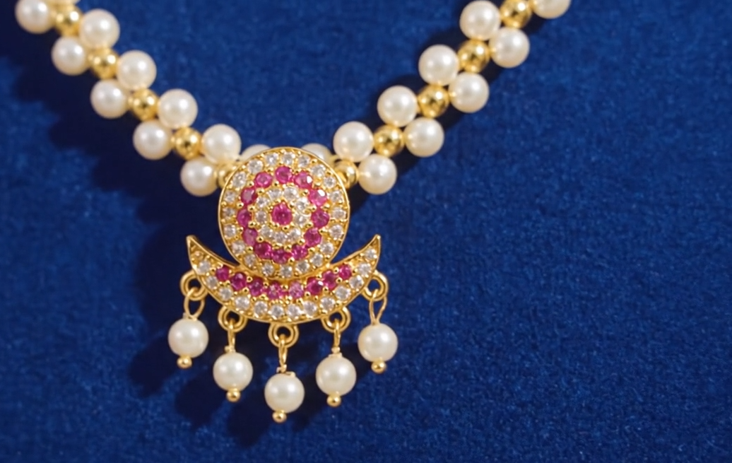 Close-up view of premium artificial Traditional Pearl Choker Necklace Set with Ruby Pendant | Innovate Art Impex by Innovate Art Impex.