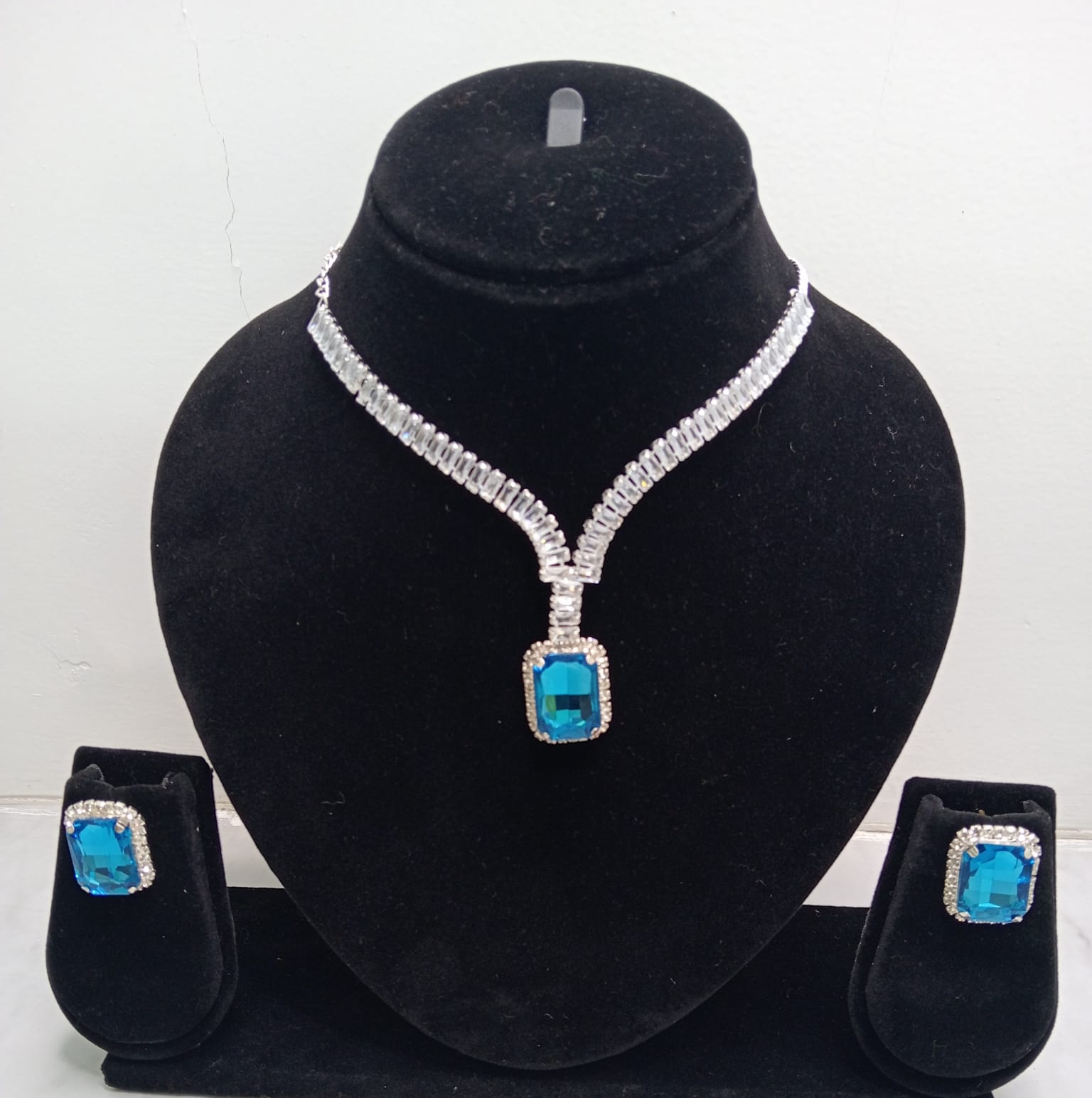 Close-up view of premium artificial Sky Blue Stone Diamond Style Necklace Set with Matching Earrings by Innovate Art Impex.