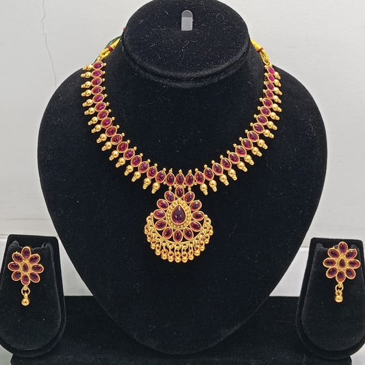 Close-up view of premium artificial Gold Plated Ruby Red Stone Traditional Necklace Set with Matching Earrings for Women by Innovate Art Impex.