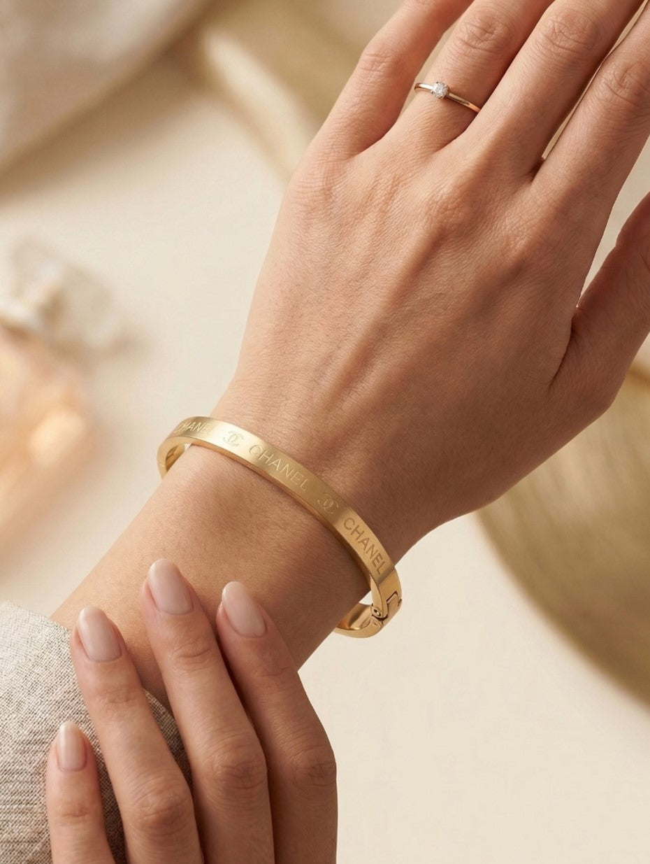 Close-up view of premium artificial Premium Gold-Plated Crown Engraved Bangle | Minimalist Designer Cuff Bracelet for Men & Women by Innovate Art Impex.