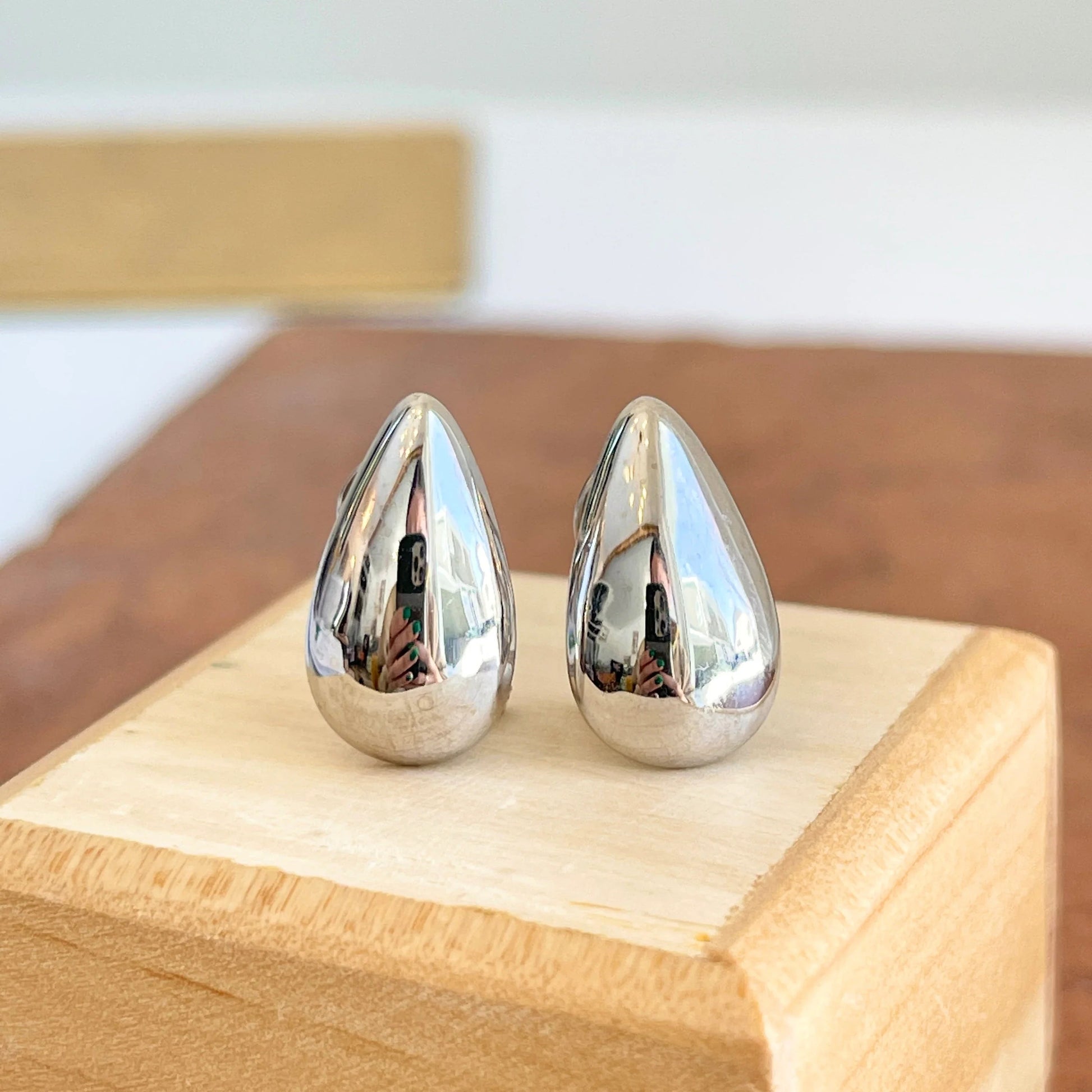 Close-up view of premium artificial Silver Plated Teardrop Stud Earrings for Women | Minimalist Daily Wear Earrings by Innovate Art Impex.