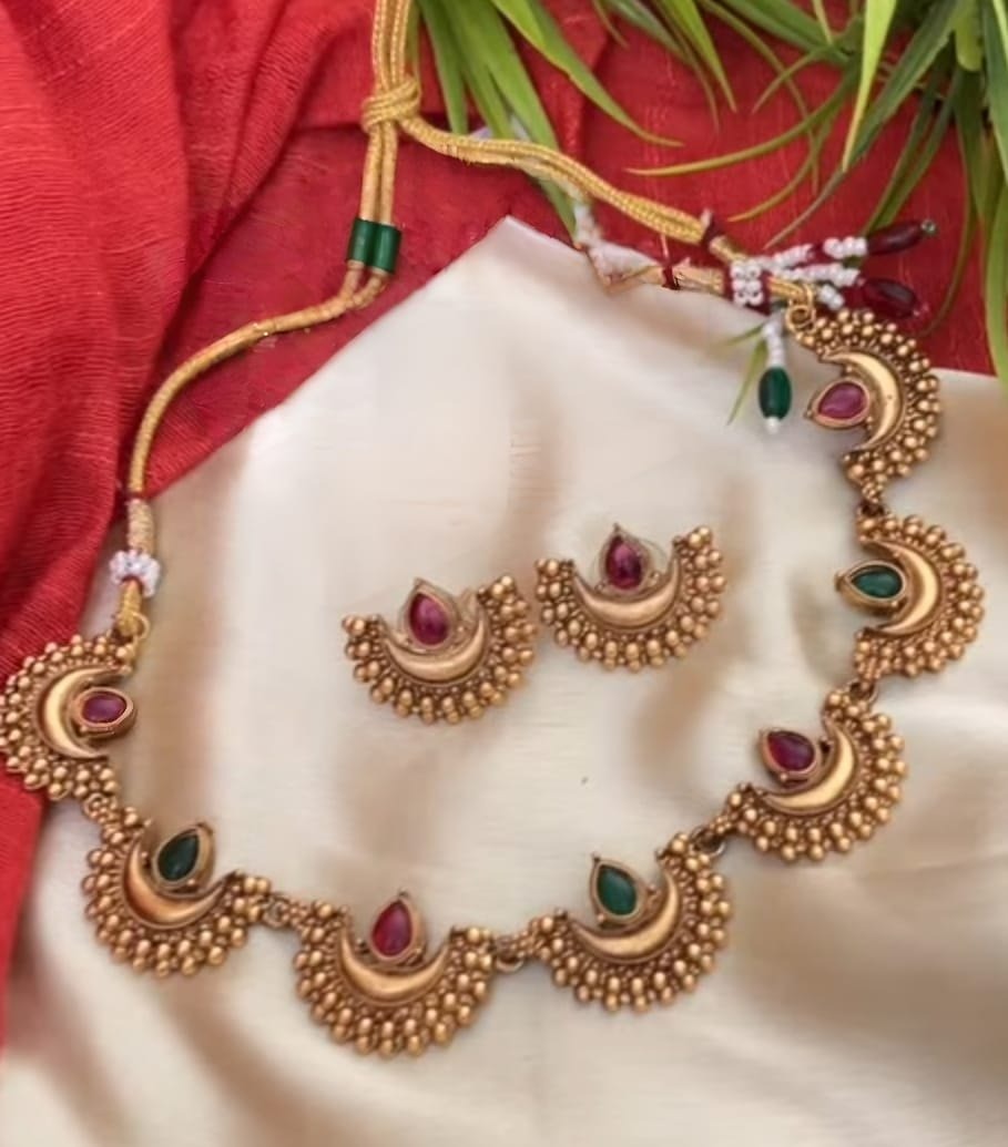 Close-up view of premium artificial Traditional Maharashtrian Chandrakor Green & Maroon Stone Necklace Set   Gold Plated by Innovate Art Impex.