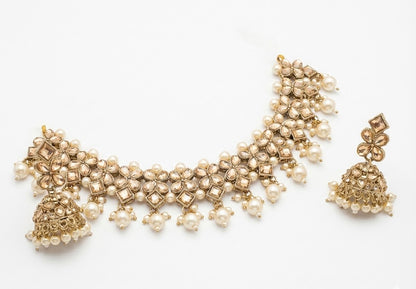Close-up view of premium artificial Antique Gold Kundan Choker Set with Pearl Drops & Matching Jhumka Earrings by Innovate Art Impex.