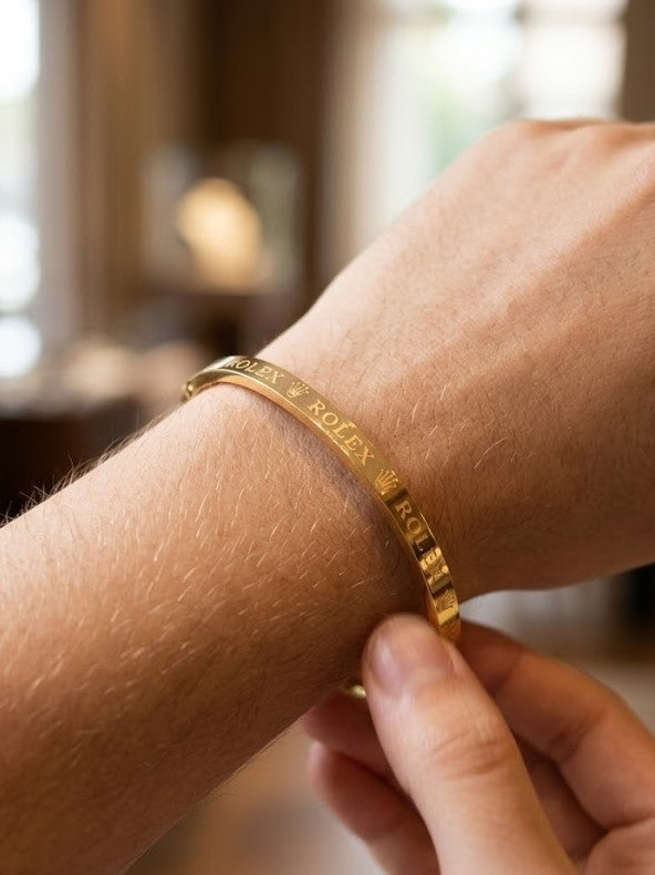 Close-up view of premium artificial Premium Gold-Plated Crown Engraved Bangle | Minimalist Designer Cuff Bracelet for Men & Women by Innovate Art Impex.